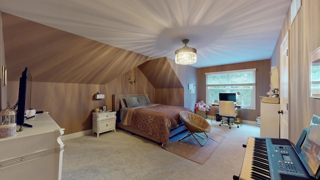 bedroom featuring lofted ceiling, light carpet, and wooden walls