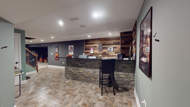 bar featuring wood walls