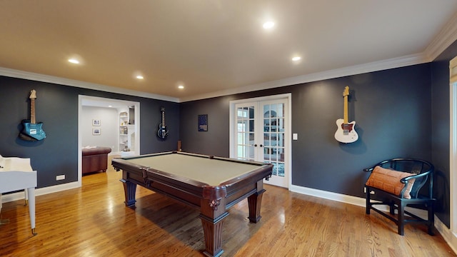 playroom with crown molding, billiards, light hardwood / wood-style floors, and french doors