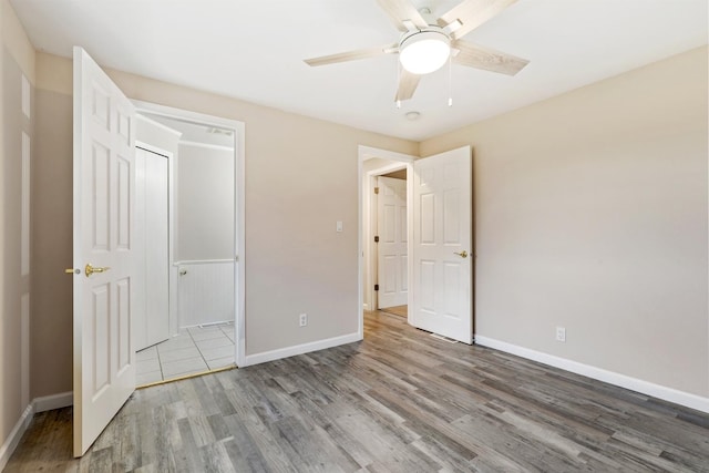 unfurnished bedroom featuring ceiling fan and light hardwood / wood-style flooring