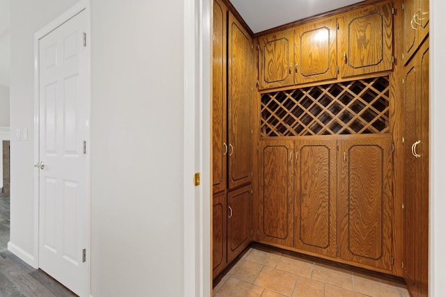 wine area featuring light tile patterned floors