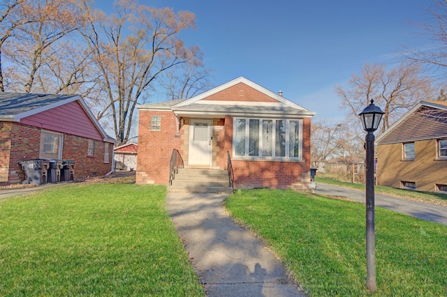 bungalow-style house featuring a front lawn