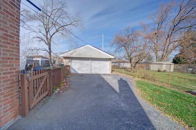 garage with a yard