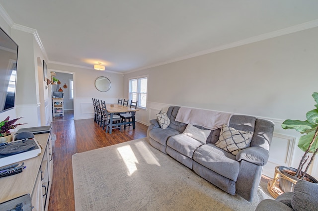 living room featuring crown molding and dark hardwood / wood-style flooring