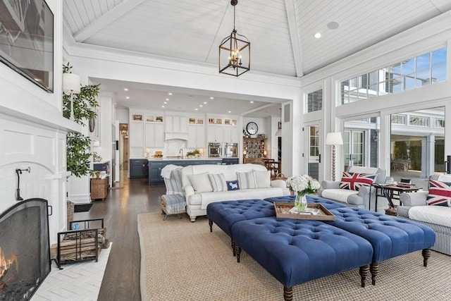 interior space with high vaulted ceiling, wood-type flooring, a notable chandelier, and wooden ceiling