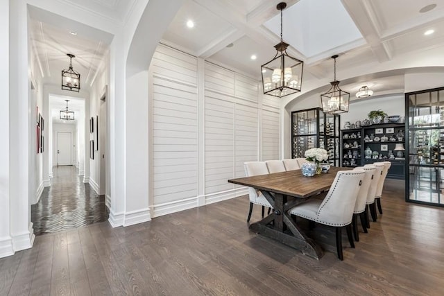 dining room with dark wood-type flooring, coffered ceiling, and beamed ceiling