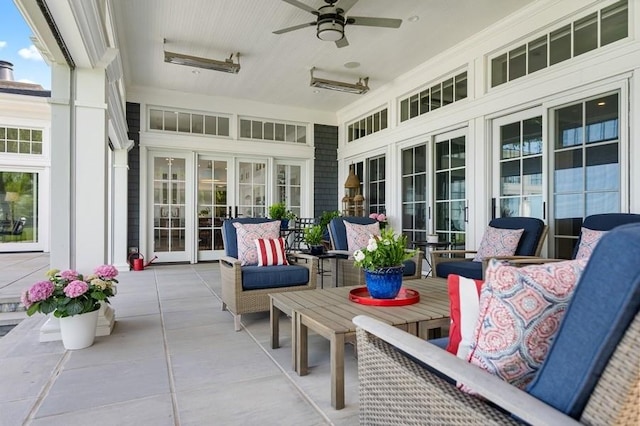 sunroom / solarium with ceiling fan and french doors