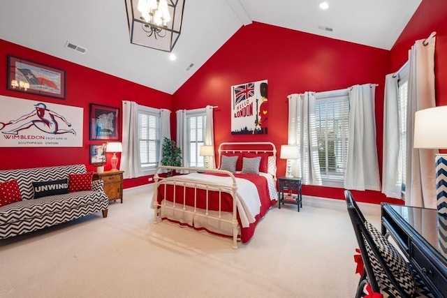 carpeted bedroom with high vaulted ceiling and a notable chandelier