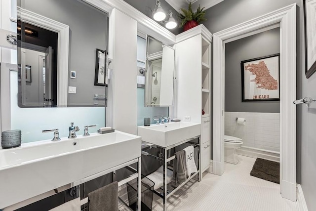 bathroom featuring toilet and tile patterned flooring