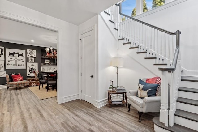 staircase with hardwood / wood-style floors