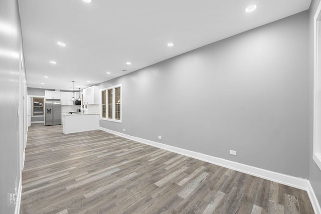 unfurnished living room featuring light wood-type flooring