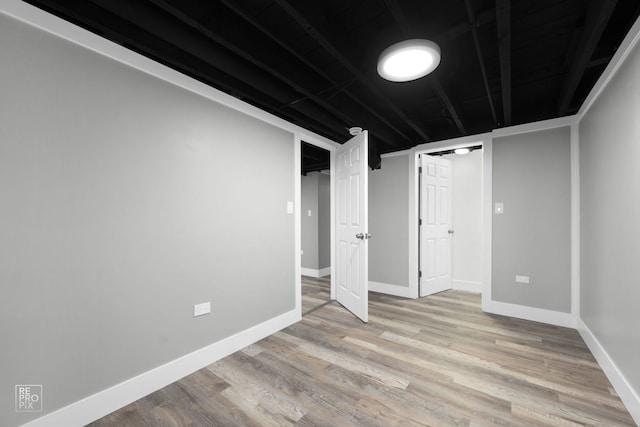 basement featuring light hardwood / wood-style flooring