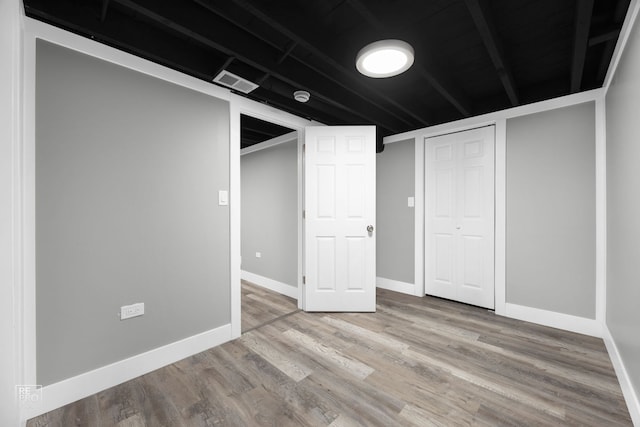 basement featuring light hardwood / wood-style flooring