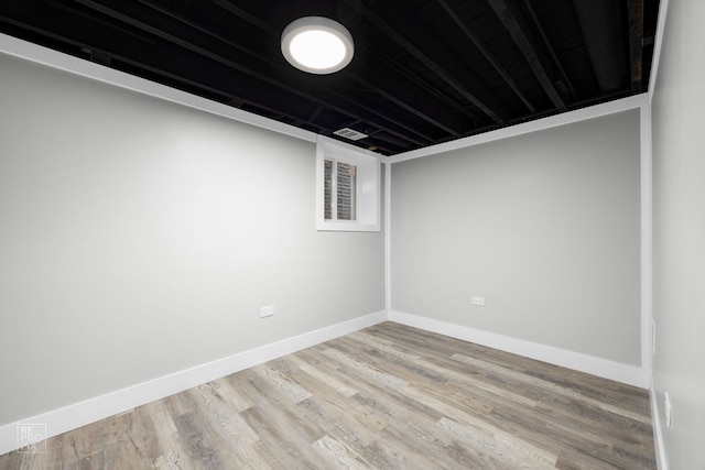 spare room featuring light hardwood / wood-style flooring