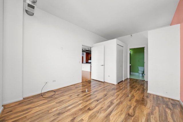 spare room with wood-type flooring