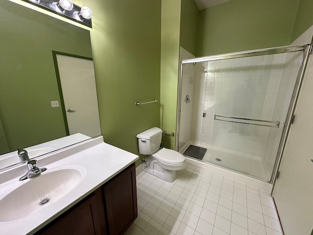 bathroom featuring walk in shower, tile patterned flooring, vanity, and toilet