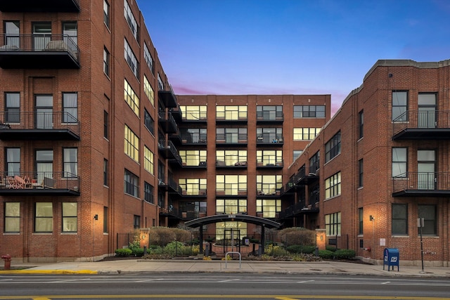 view of outdoor building at dusk