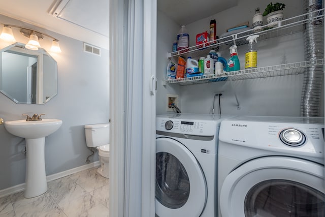 laundry room featuring separate washer and dryer