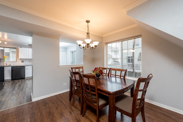 dining room featuring ornamental molding, dark hardwood / wood-style floors, and a notable chandelier