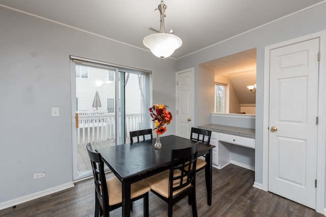 dining room featuring vaulted ceiling and dark hardwood / wood-style floors