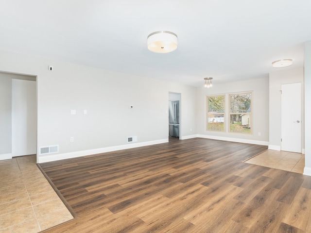 unfurnished living room featuring hardwood / wood-style floors