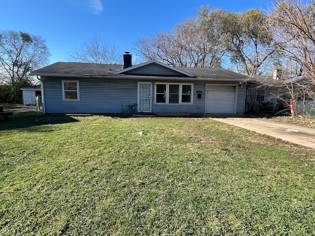 single story home with a front yard and a garage