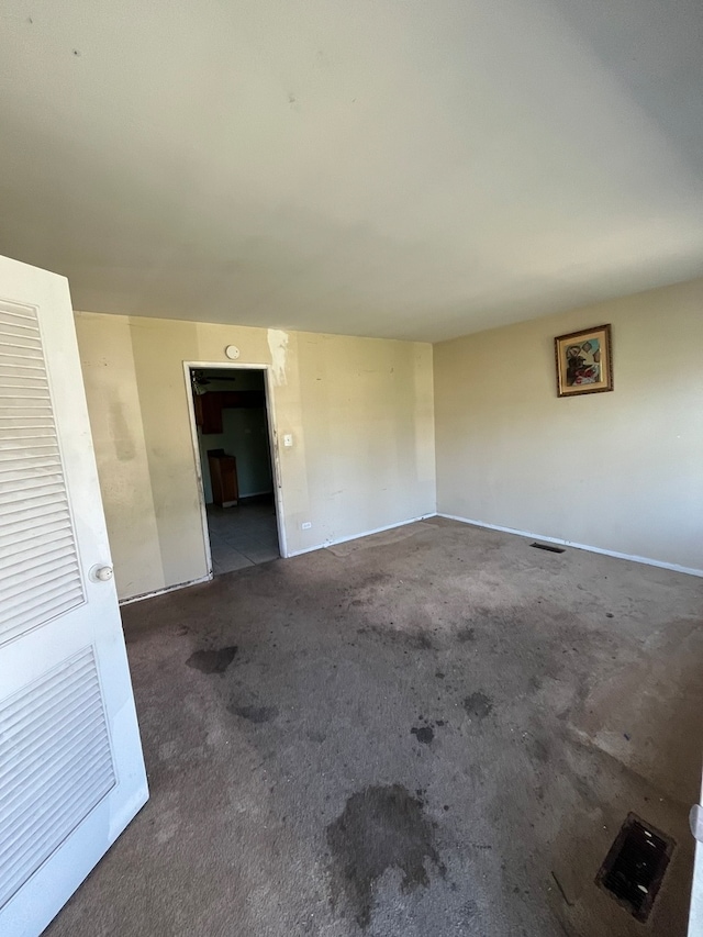 empty room with dark carpet