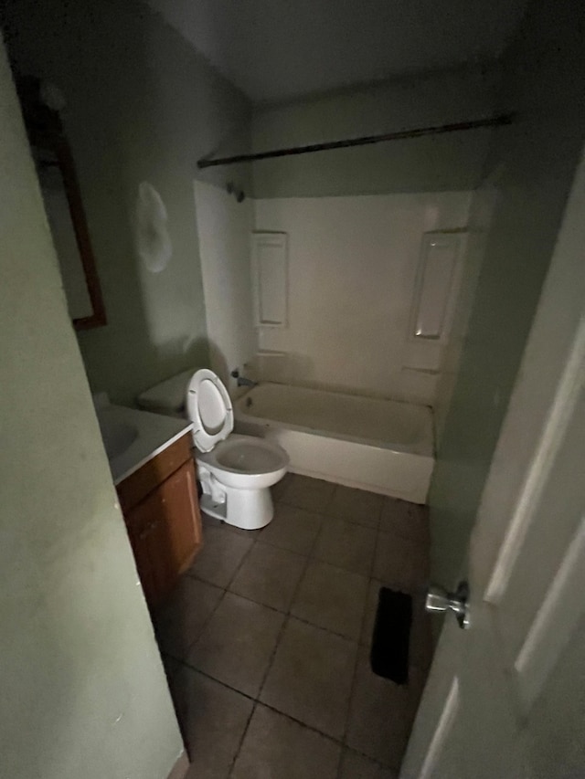 full bathroom with toilet, vanity, shower / bath combination, and tile patterned floors