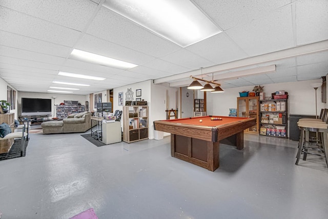 recreation room with billiards, concrete flooring, and a drop ceiling