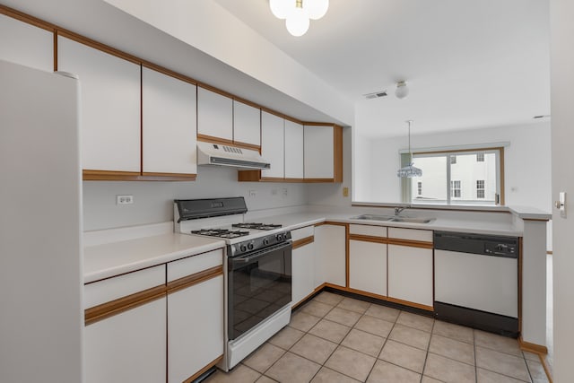 kitchen with pendant lighting, white appliances, white cabinets, sink, and light tile patterned floors