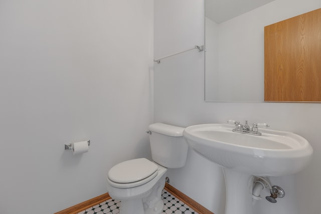 bathroom with toilet and sink