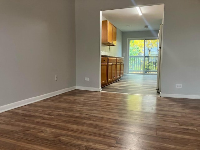 interior space with dark hardwood / wood-style flooring