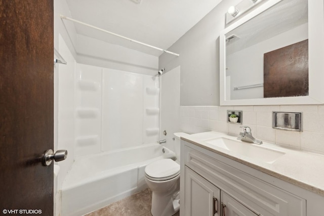 full bathroom with toilet, bathtub / shower combination, tile walls, vanity, and tile patterned flooring