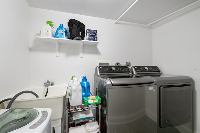 laundry room featuring washing machine and clothes dryer