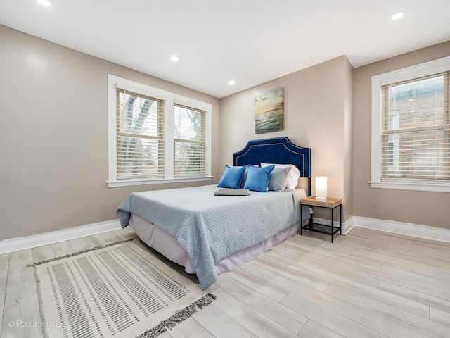 bedroom featuring recessed lighting, light wood-style flooring, and baseboards