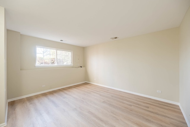 unfurnished room with light hardwood / wood-style floors