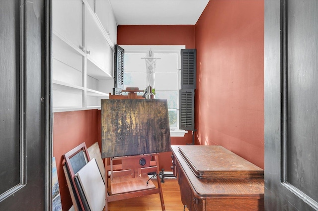 home office with hardwood / wood-style flooring