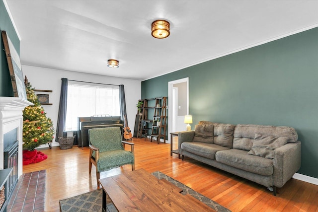 living room with hardwood / wood-style floors and ornamental molding