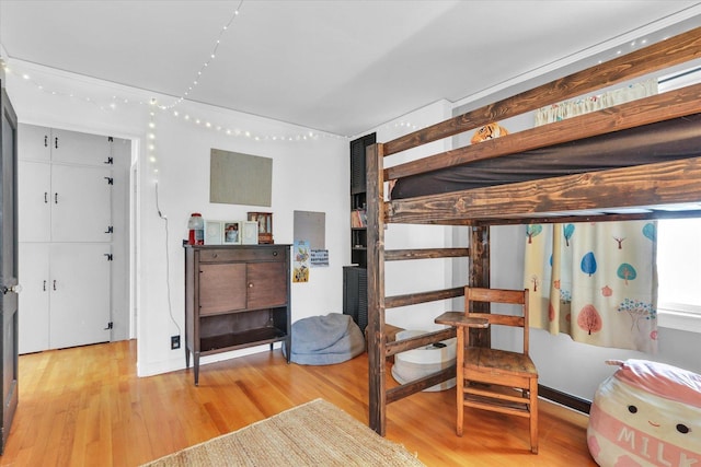 bedroom with light wood-type flooring