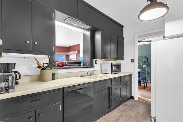 kitchen featuring dishwasher, white refrigerator, sink, and light hardwood / wood-style flooring