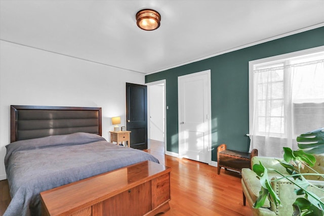 bedroom with wood-type flooring