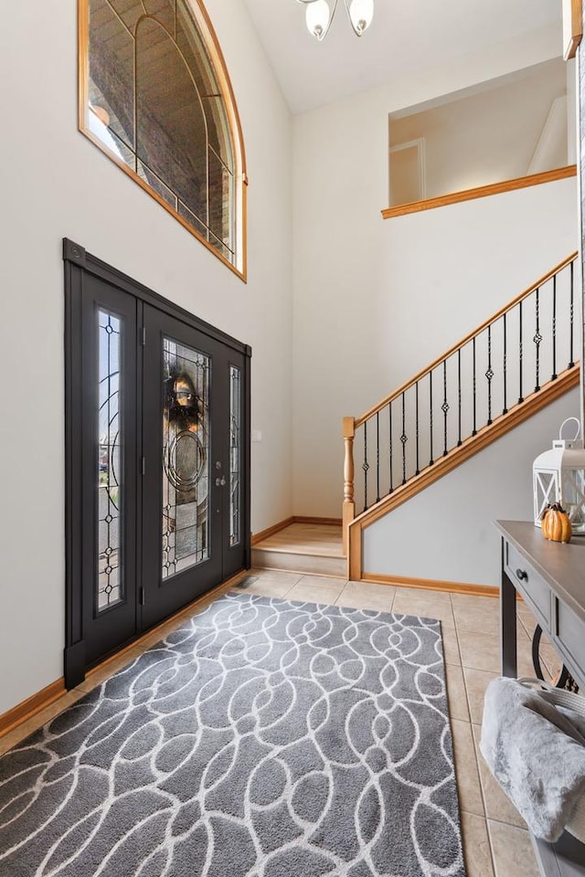 entryway featuring a notable chandelier and light tile patterned floors