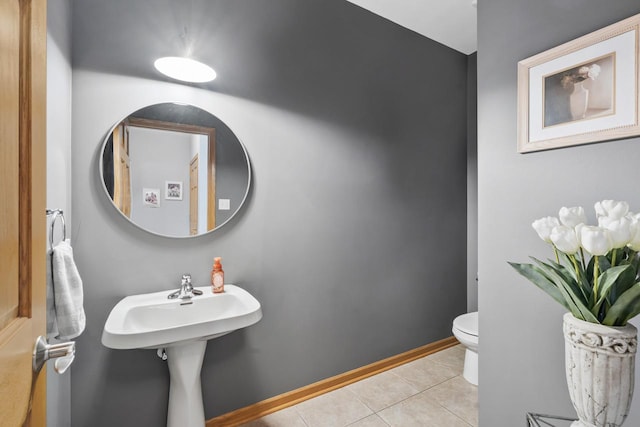 bathroom featuring tile patterned flooring and toilet