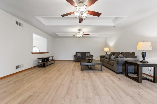 living room with ceiling fan and light hardwood / wood-style floors