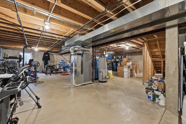 basement featuring gas water heater and heating unit