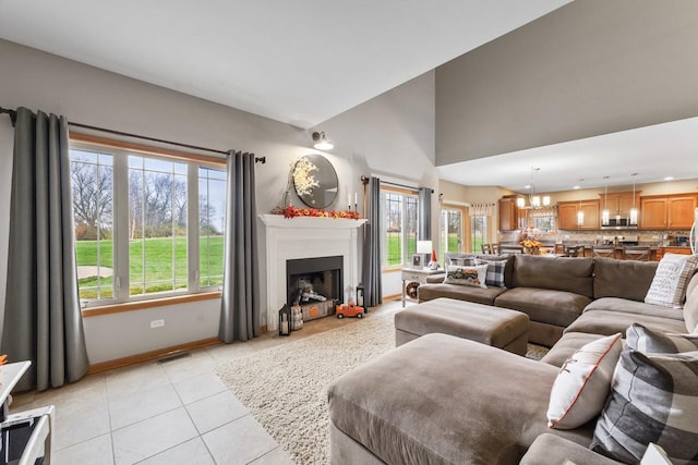 tiled living room featuring an inviting chandelier