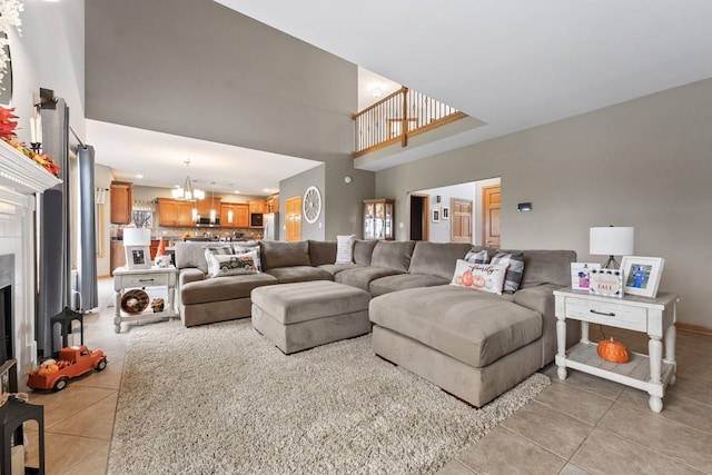 living room featuring a chandelier and light tile patterned flooring