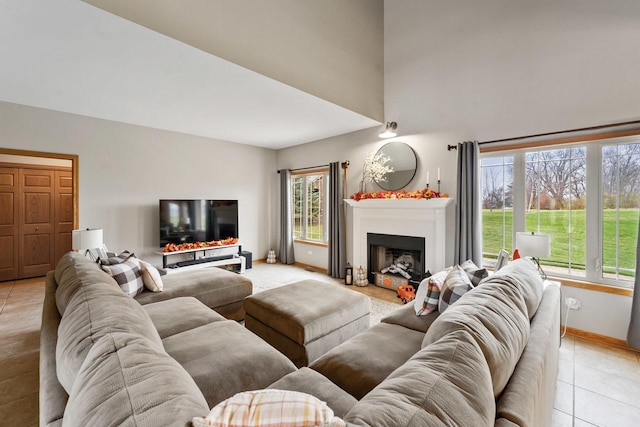 living room with a wealth of natural light and light tile patterned floors