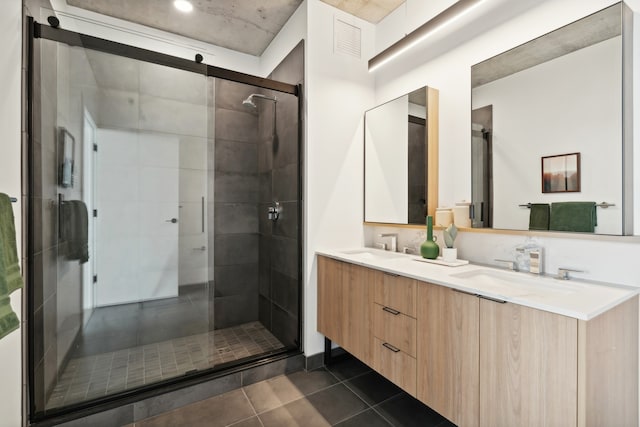 bathroom featuring tile patterned flooring, vanity, and an enclosed shower