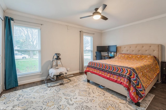 bedroom with ornamental molding, hardwood / wood-style floors, and ceiling fan